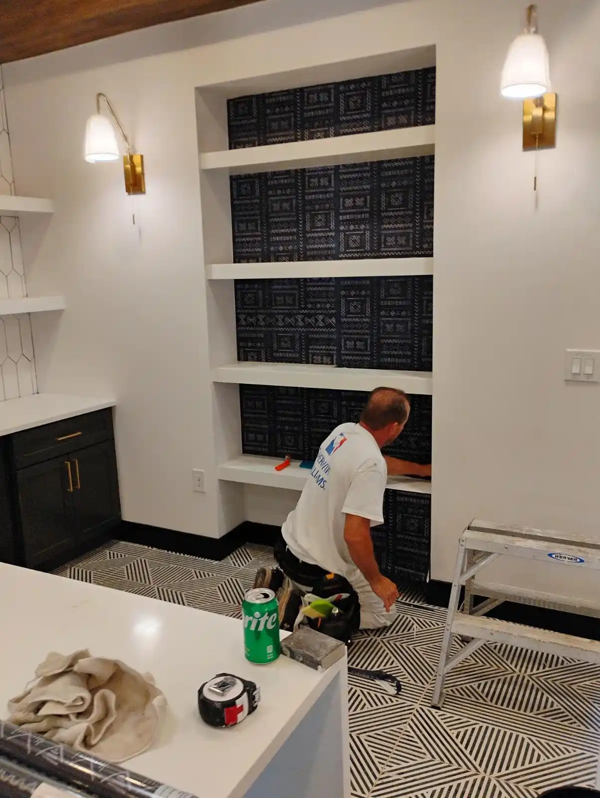 Wallpaper installation team member